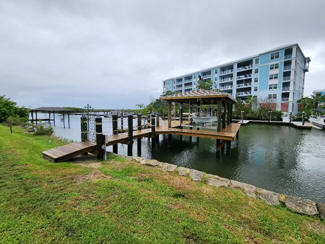 Building Photo - Gorgeous Riverfront 3/3 Saltwater Pool Hom...