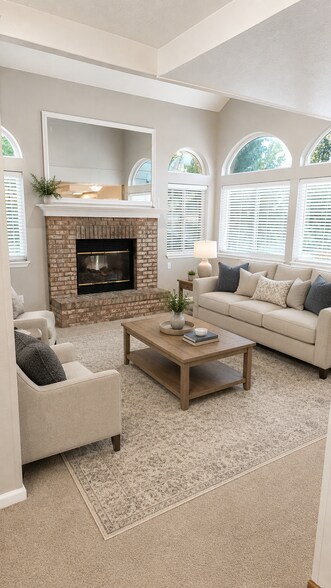 Family room with electric fireplace, wood blinds - 6782 Swadley Court