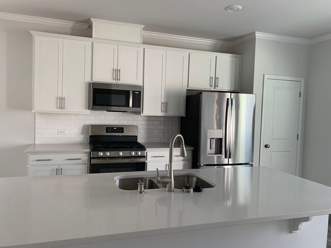 Building Photo - Gorgeous New Construction Townhome! Great ...