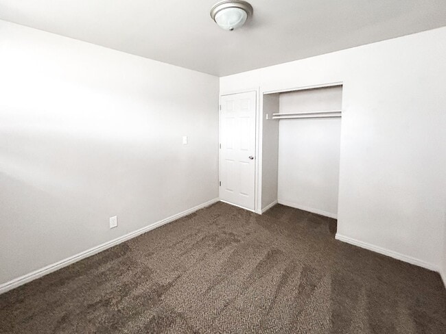 Building Photo - Spacious 5-Bedroom Home with Lofted Garage