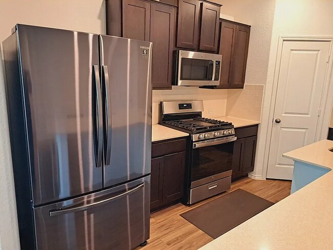 Building Photo - COMING SOON! Beautiful 4BR 3BA w/ Fenced Backyard • Private Yard• Attached Garage in Siena