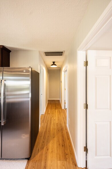 Hallway. Full bath and 1/2 bath on left. Bedroom #1 and #2 on right - 8717 NE Webster St