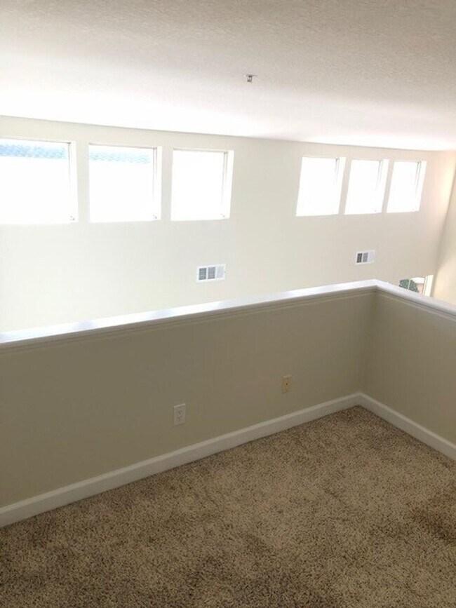 Building Photo - PICTURE PERFECT 2 BR/2 BATH PLUS LOFT END UNIT CONDO WITH DIRECT ACCESS 2 CAR GARAGE