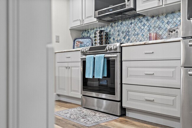 Building Photo - Two Bedroom/Two and a half bath gated townhome.