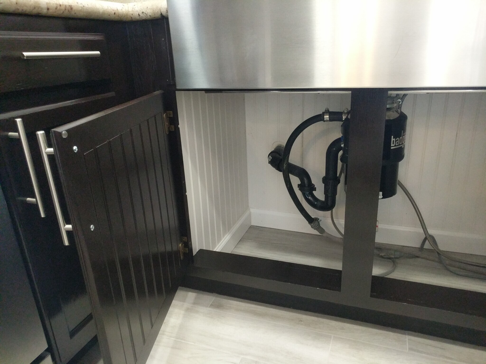 Tile under the sink, lots of room, very clean. - 14101 N 78th Dr