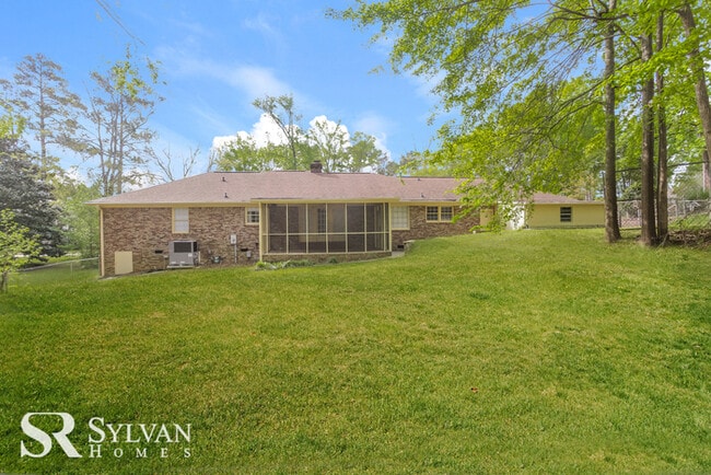 Building Photo - Come view this charming brick home