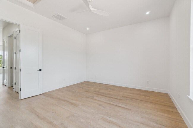 Building Photo - Bright. Clean. Calm. Your Elevated One-Bed...