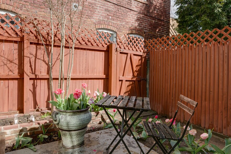 Backyard is communal space with upstairs tenants - 1819 North Capitol St NE