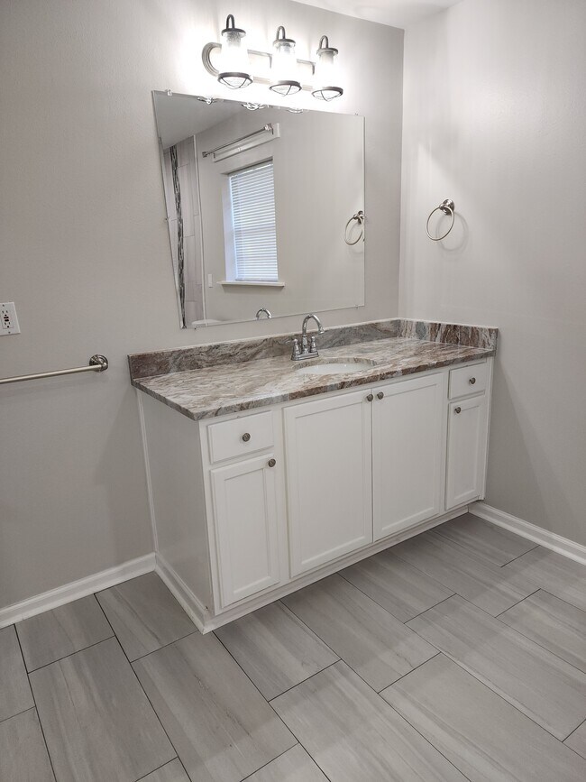 vanity area with granite countertop - 1939 S Ringer Ave