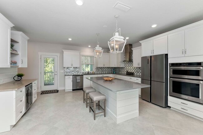 Building Photo - Introducing a captivating 3-story townhome...