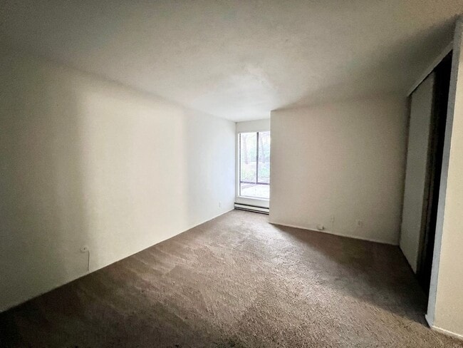 Building Photo - Cozy 1 bedroom on lush courtyard includes water / garbage & 1 parking spot.