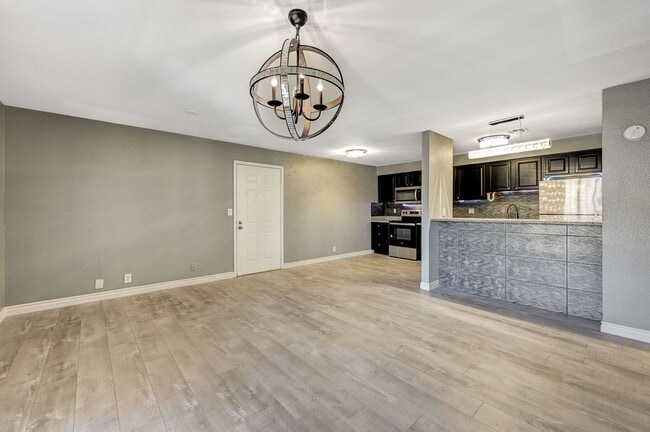 Building Photo - GATED COMMUNITY CONDO WITH BRAND NEW UPGRADES THROUGHOUT