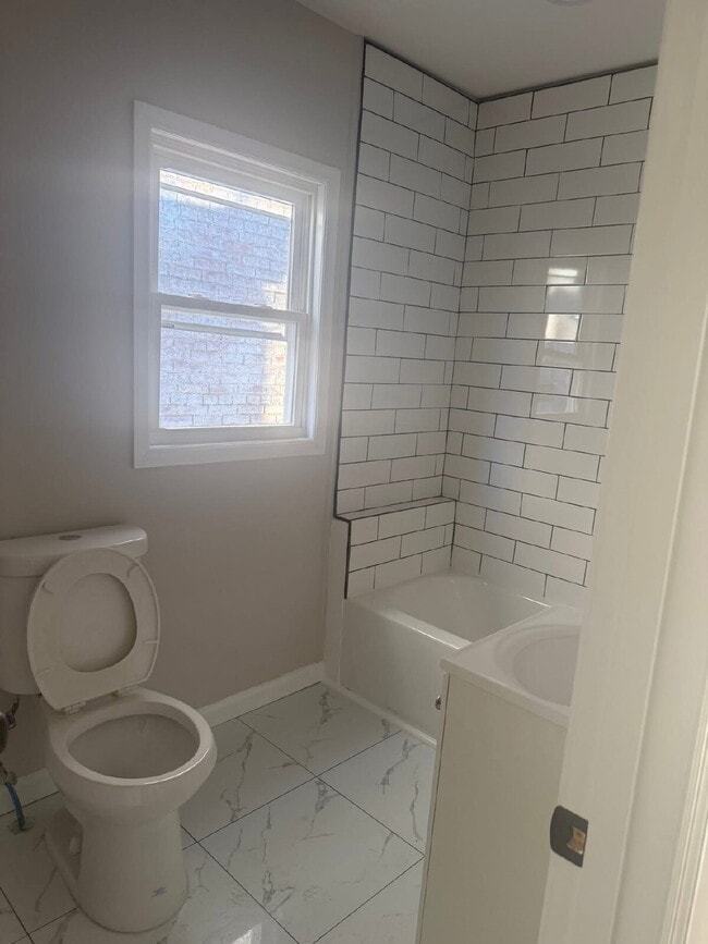 Building Photo - "Charming 4-Bedroom Townhouse in Trenton – Ideal Urban Living on MLK Jr. Blvd!"