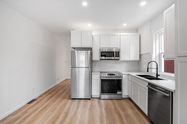 Building Photo - $1795 - Single Family Home with Private Two-Level Living Spaces, Driveway Parking & Modern Updates
