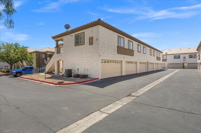 Building Photo - Sleek 2 Bedroom Condo with 2 Car Garage Ne...