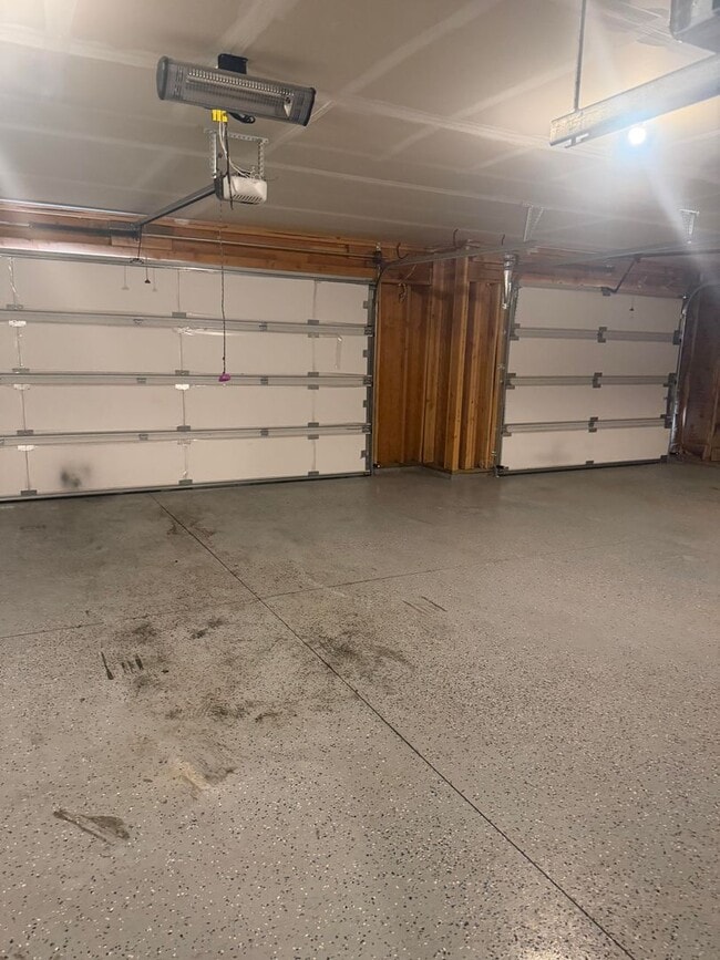 Building Photo - Lots of storage space in this 4- Car garage for all your playthings!!