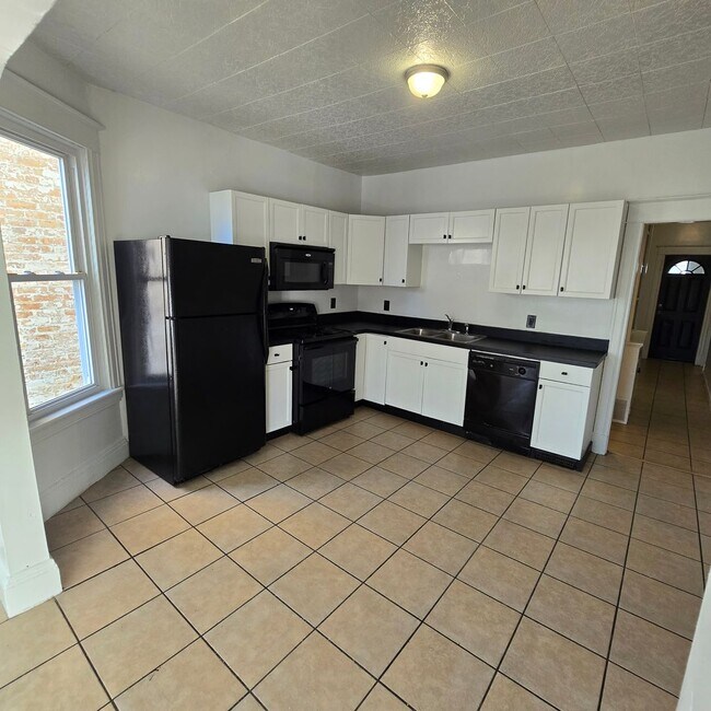 Building Photo - Large remodeled 4 bedroom with off street parking available