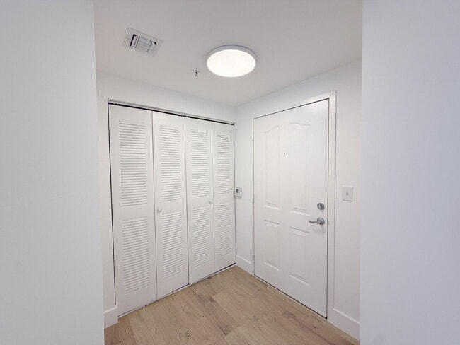 Building Photo - Rare 2/2 Corner Penthouse with Panoramic Lagoon Views from Every Room – Available Now!