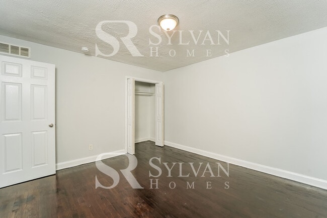 Building Photo - The living is easy in this 4 bedroom, 2 bathroom townhome