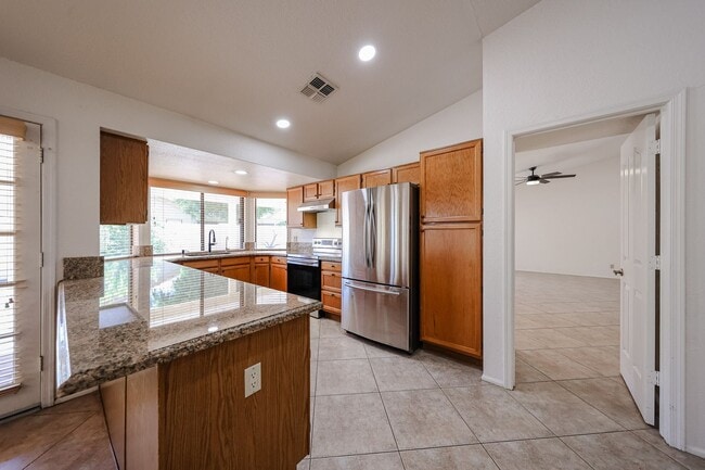 Building Photo - Welcome to this stunning 4-bedroom, 2-bath...