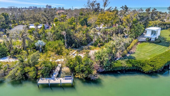 Building Photo - ALL THE CHARM! - Siesta Key 1+ acre on the Bay - 3 bed/ 2 bath pool home