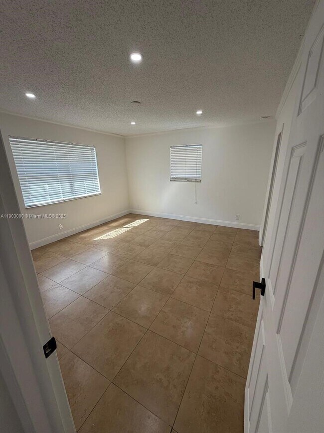 Building Photo - 10701 Royal Palm Blvd