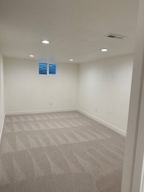 Building Photo - Modern finishes, spacious living, huge fenced backyard