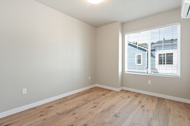 Building Photo - NEW CONSTRUCTION – Stylish 4-Bedroom Townh...