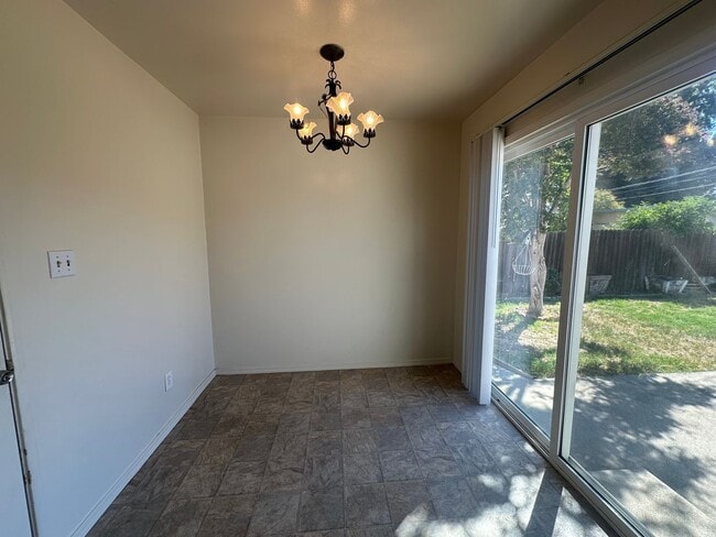 Building Photo - Three Bedroom Two Bathroom Home with Yard