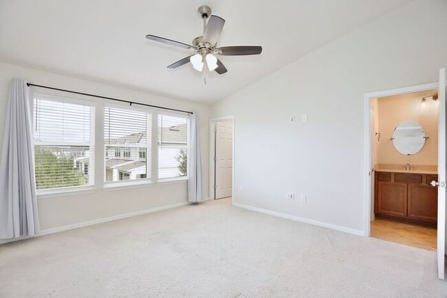Building Photo - Immaculate Townhome · Dual En-Suite Bedrooms + Flex Loft · Cable & Internet Included · 3.5 Miles ...