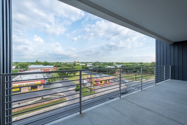 Building Photo - South Austin 2BR Condo with Balcony & Luxury Amenities