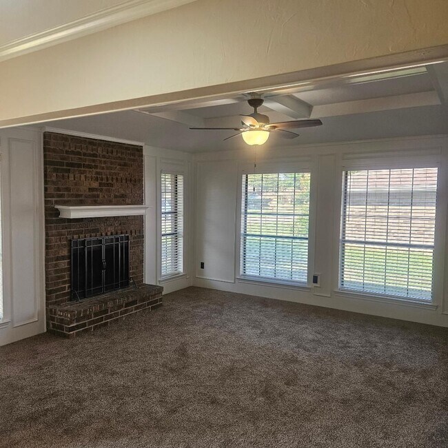 Building Photo - Three bedroom and two bathroom nicely remodeled with new flooring. Large wood fenced backyard