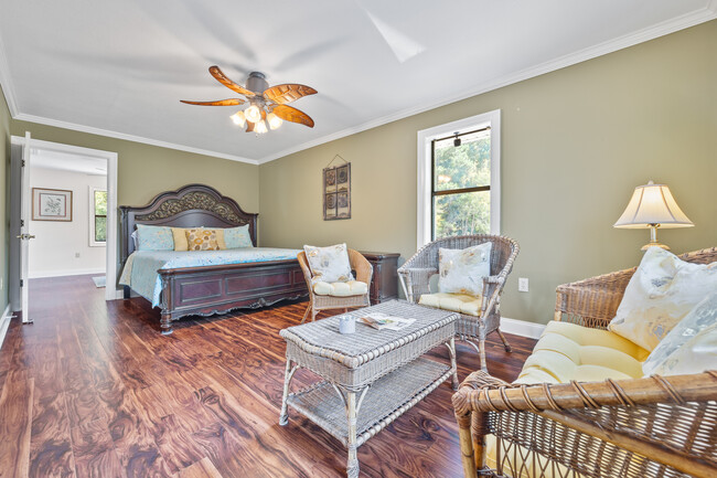 Master bedroom features a King-sized bed and 1 Queen-sized pull-out couch - 1090 Quail Trl