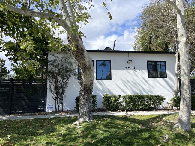 Front of Triplex with secured gated access and perimeter security cameras - 3211 W Alameda Ave