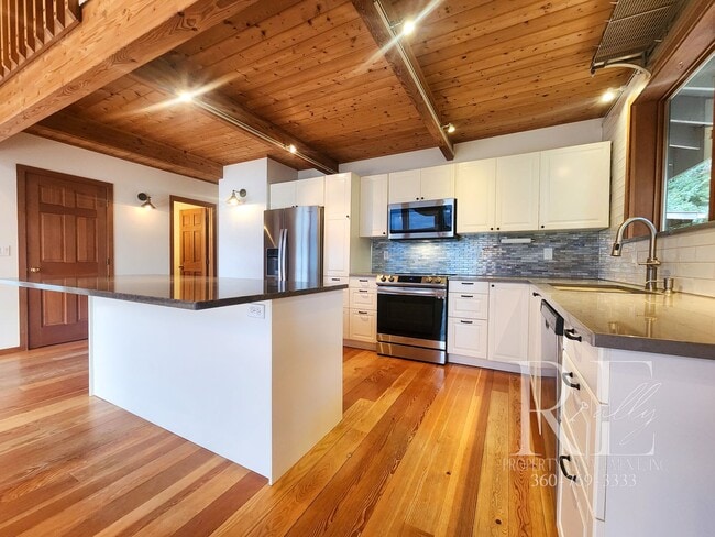 Building Photo - Waterfront Living in Indianola – Dock, Bea...