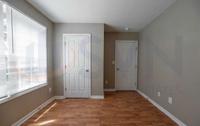 Building Photo - Welcome to this spacious 4-bedroom, 2.5-ba...