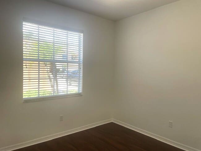 Building Photo - Elegant 3 Bedroom End-Unit Condo with Screened Lanai & Pond Views and A Private Garage