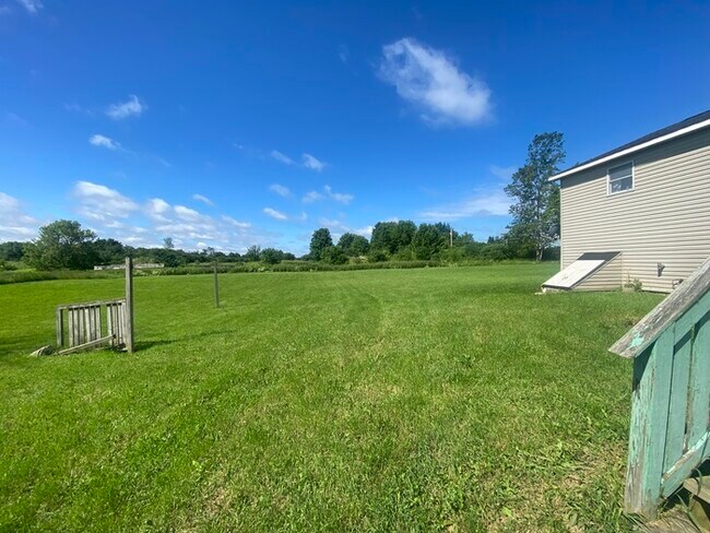 Building Photo - Beautiful secluded 4 bedroom 2.5 bath home with 2 stall detached garage and descent sized yard