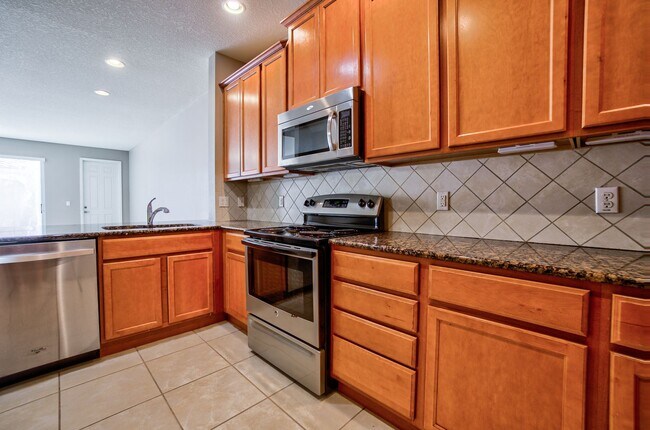 Building Photo - Beautiful 3/3 w/ 2 Car Garage in Gated Vil...