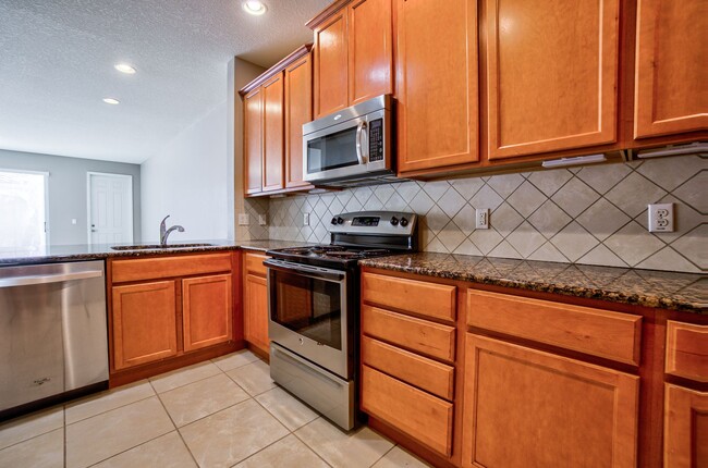 Building Photo - MOVE IN SPECIAL- Beautiful 3/3 w/ 2 Car Ga...