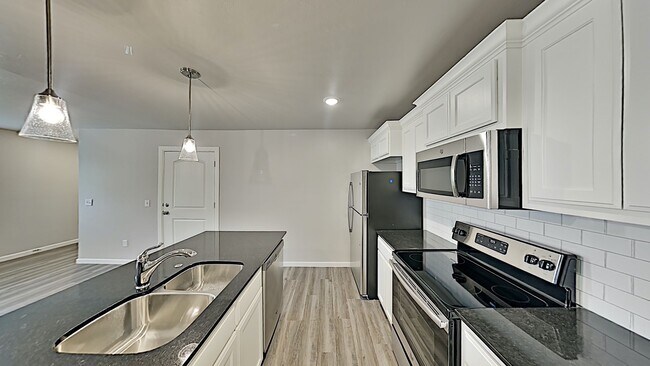 Building Photo - 2 Bedroom 2 Bathroom 2 Car Garage Duplex close to Broadway Extension, a short distance from Edmon...