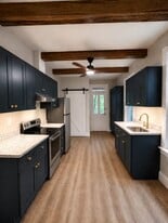 Full kitchen, dishwasher, electric stove, and half bath. - 529 W Frederick St
