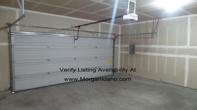 Building Photo - 2-car garage, mowing included, convenientl...