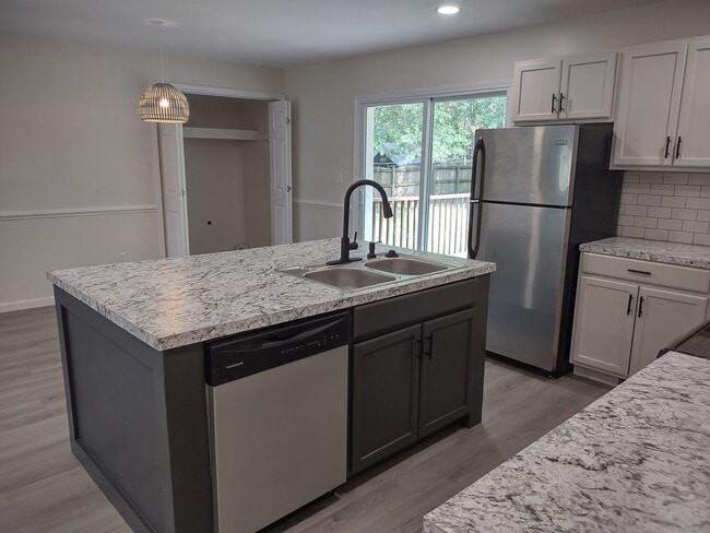 Building Photo - Tastefully Upgraded Four Bedroom Brick Hom...