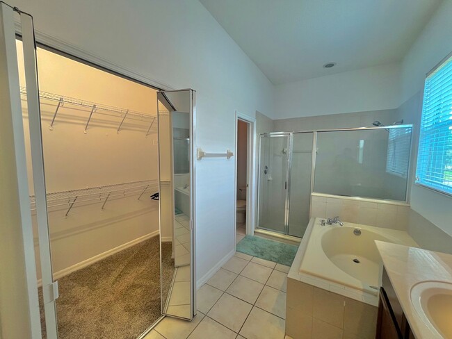 Building Photo - Spacious 4-Bed, 3-Bath Home in Guard-Gated...