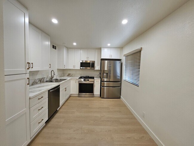 Building Photo - Modern Comfort Meets Convenience — 4-Bedro...
