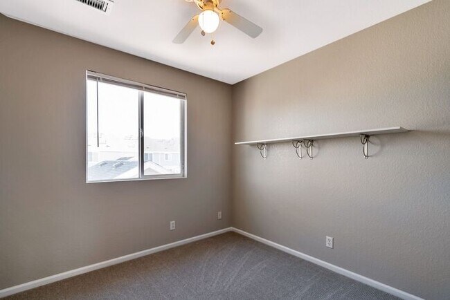 Building Photo - 3BR Townhome Near DIA & Light Rail | New Carpet, Garage & Fenced Patio
