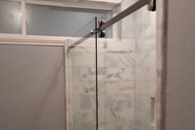 Walk in shower. Marble Tile. - 2021 Santa Rosa St