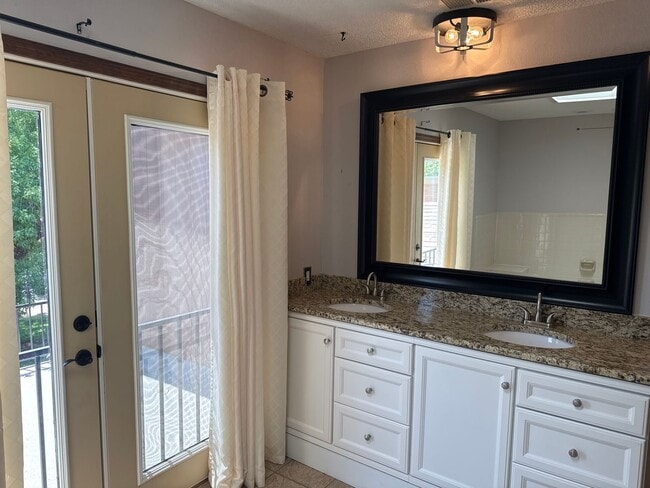 Building Photo - Two-story, four-bedroom, three-bathroom ho...