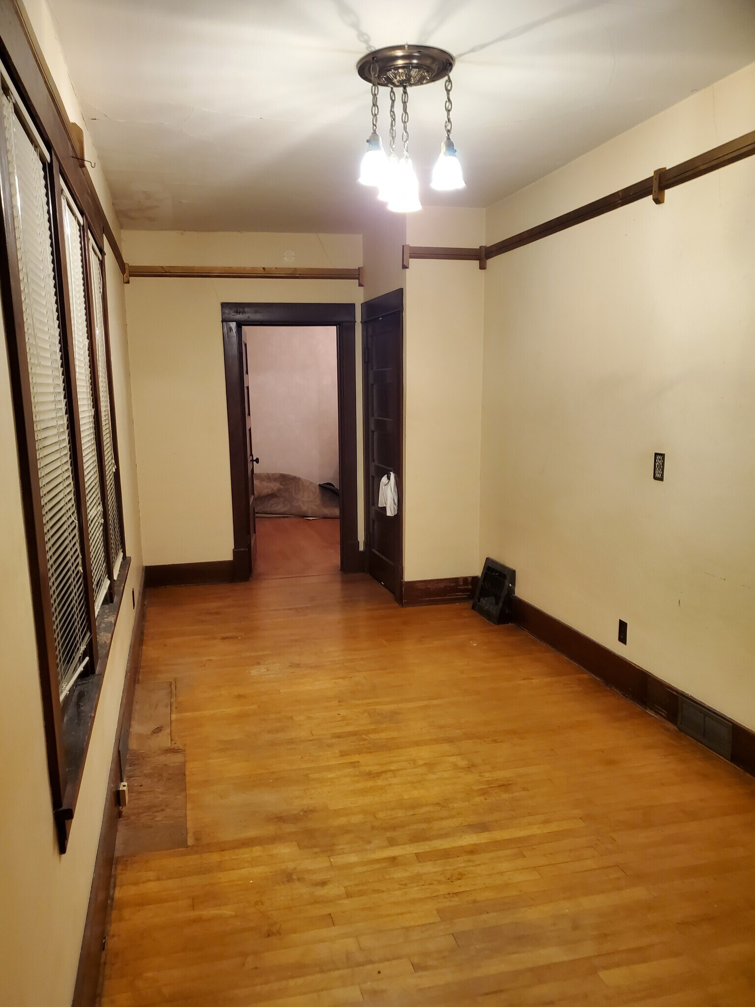 bedroom looking into dining room with walk-in closet door - 606 7th St N